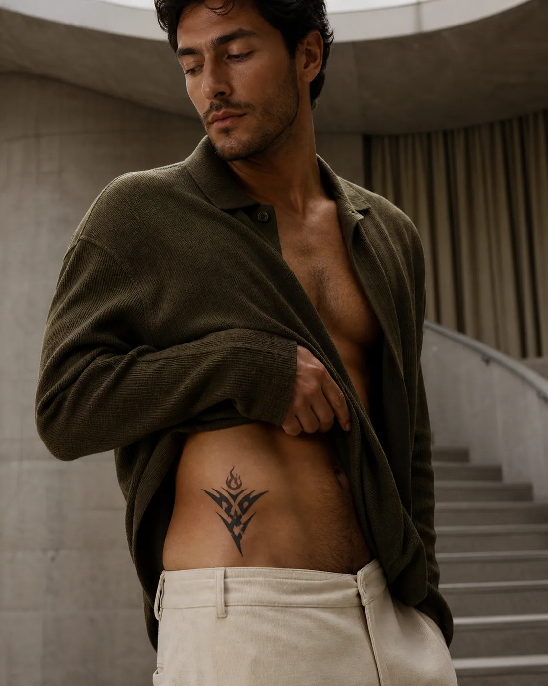 Tribal tattoo of three folded planes supporting a small living flame as a complementary couple tattoo pair on the hip